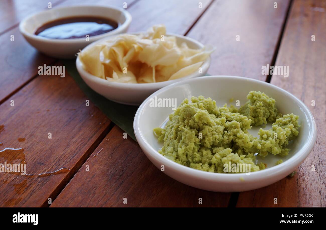 Dishes of green wasabi, pickled ginger and soy sauce Japanese