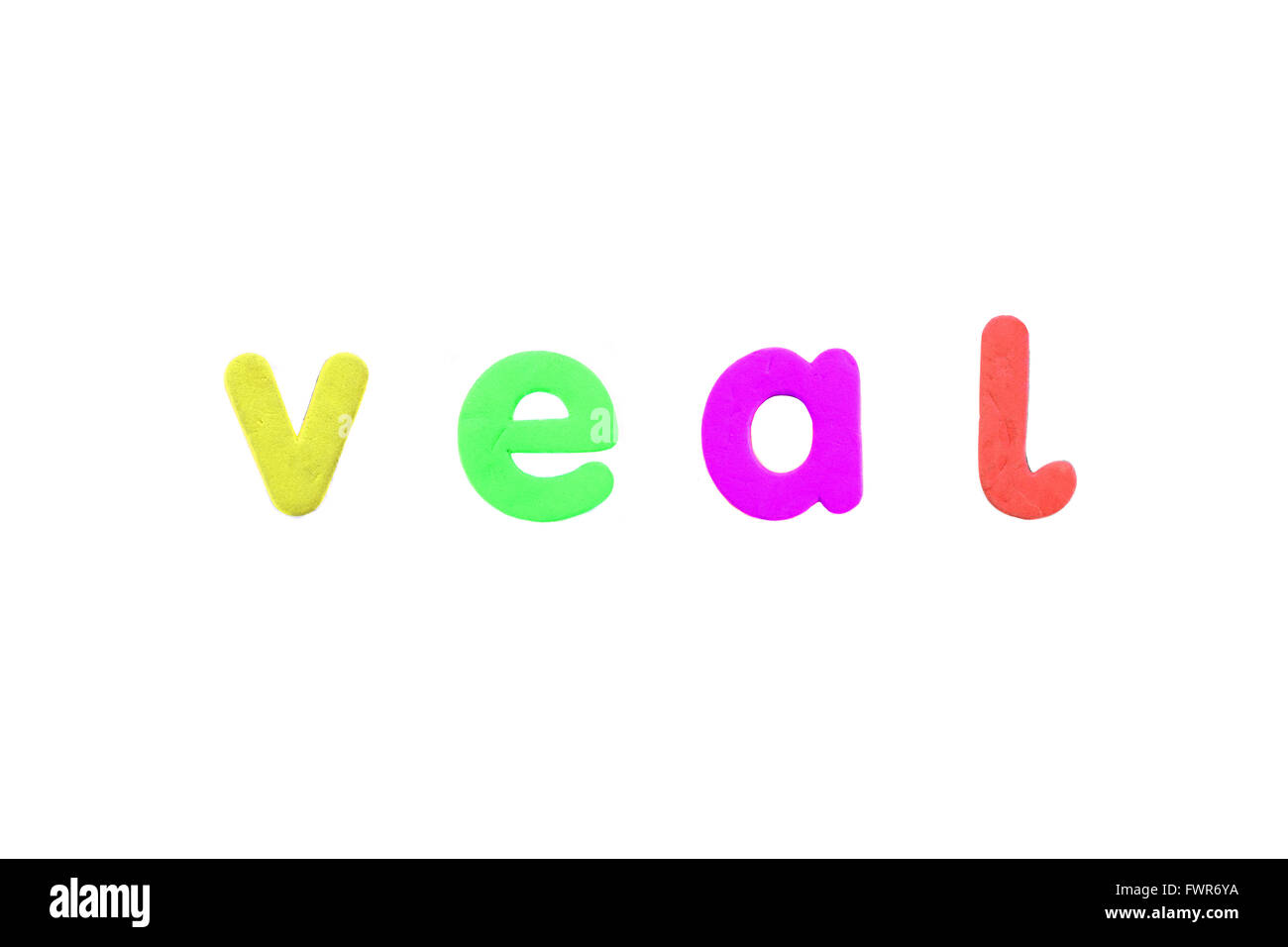 The word veal created from alphabetic fridge magnets against a white background. Stock Photo