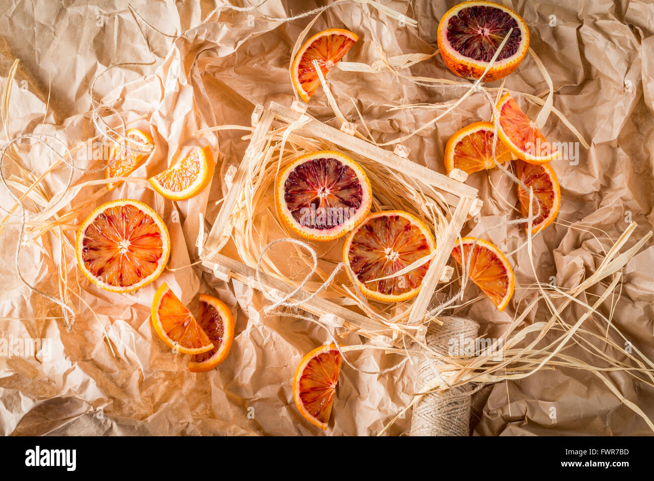 Blood oranges on wrapping paper with string Stock Photo
