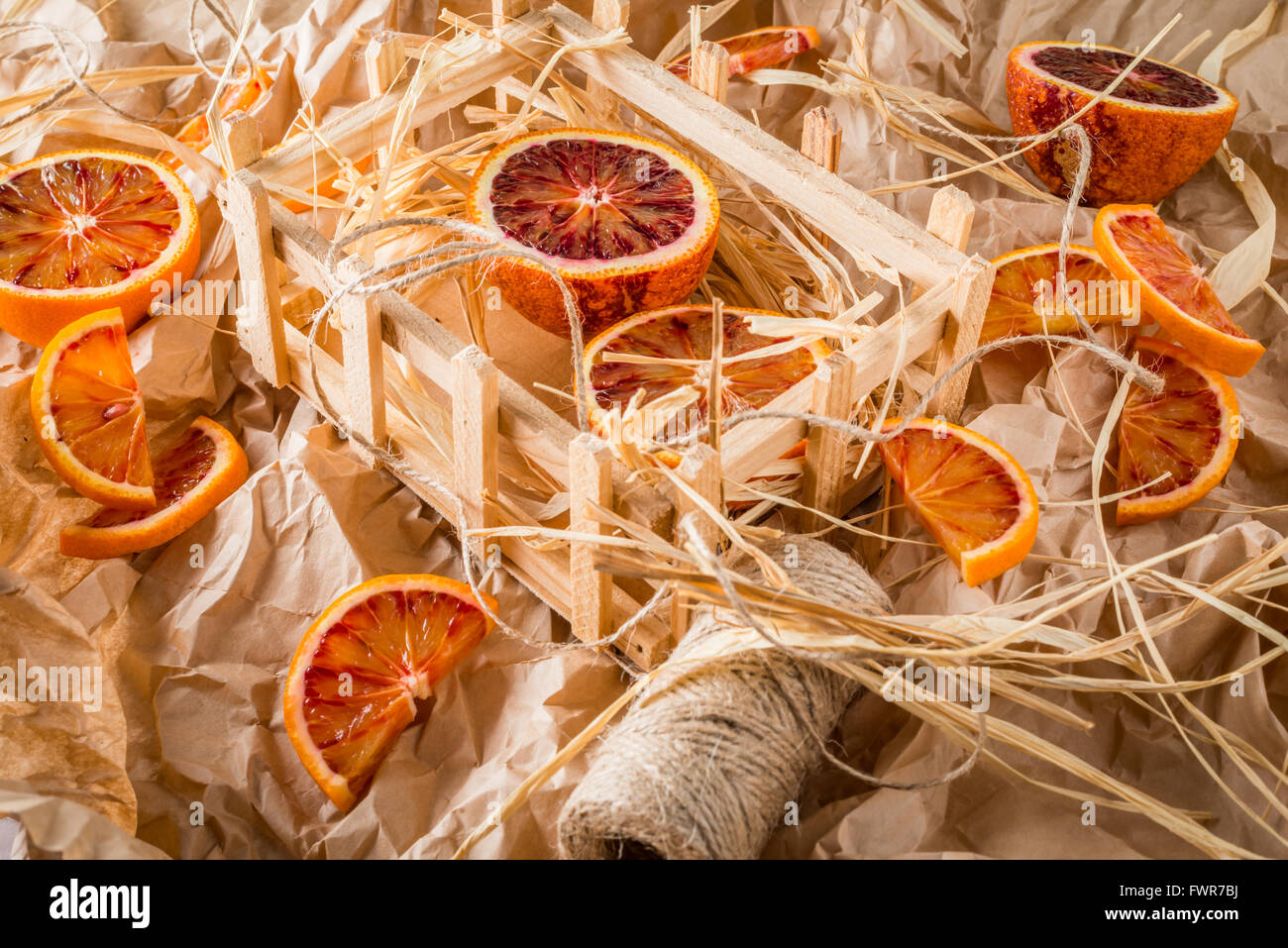 Blood oranges on wrapping paper with string Stock Photo