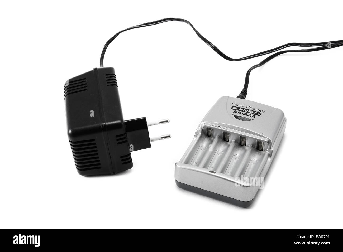 Silver colored battery charger and 230 volt adapter Stock Photo