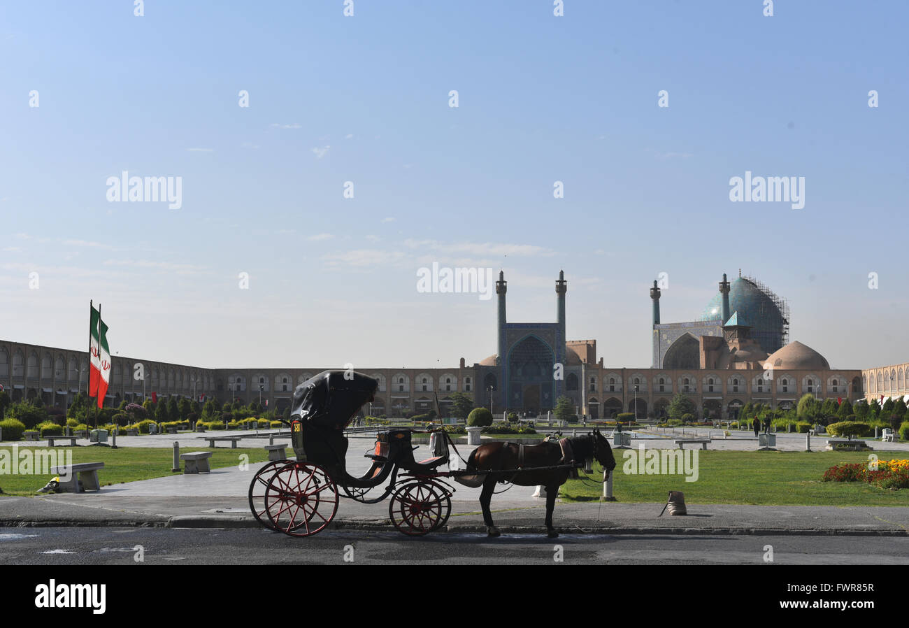 The peaceful morning calm of horse & carriage in Naqsh-e Jahan Square, Isfahan, Iran. Stock Photo