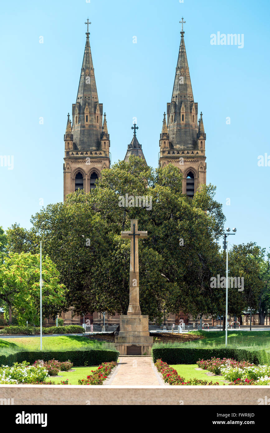 Cross of Sacrifice with St Peter's Cathedral on the background, Pennington Gardens, South Australia Stock Photo
