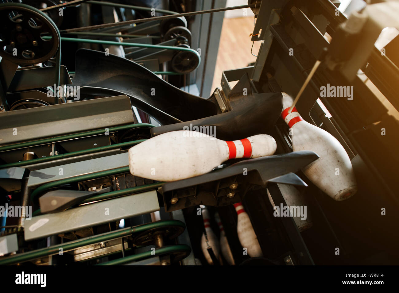 Pins on bowling pinsetter machine Stock Photo Alamy
