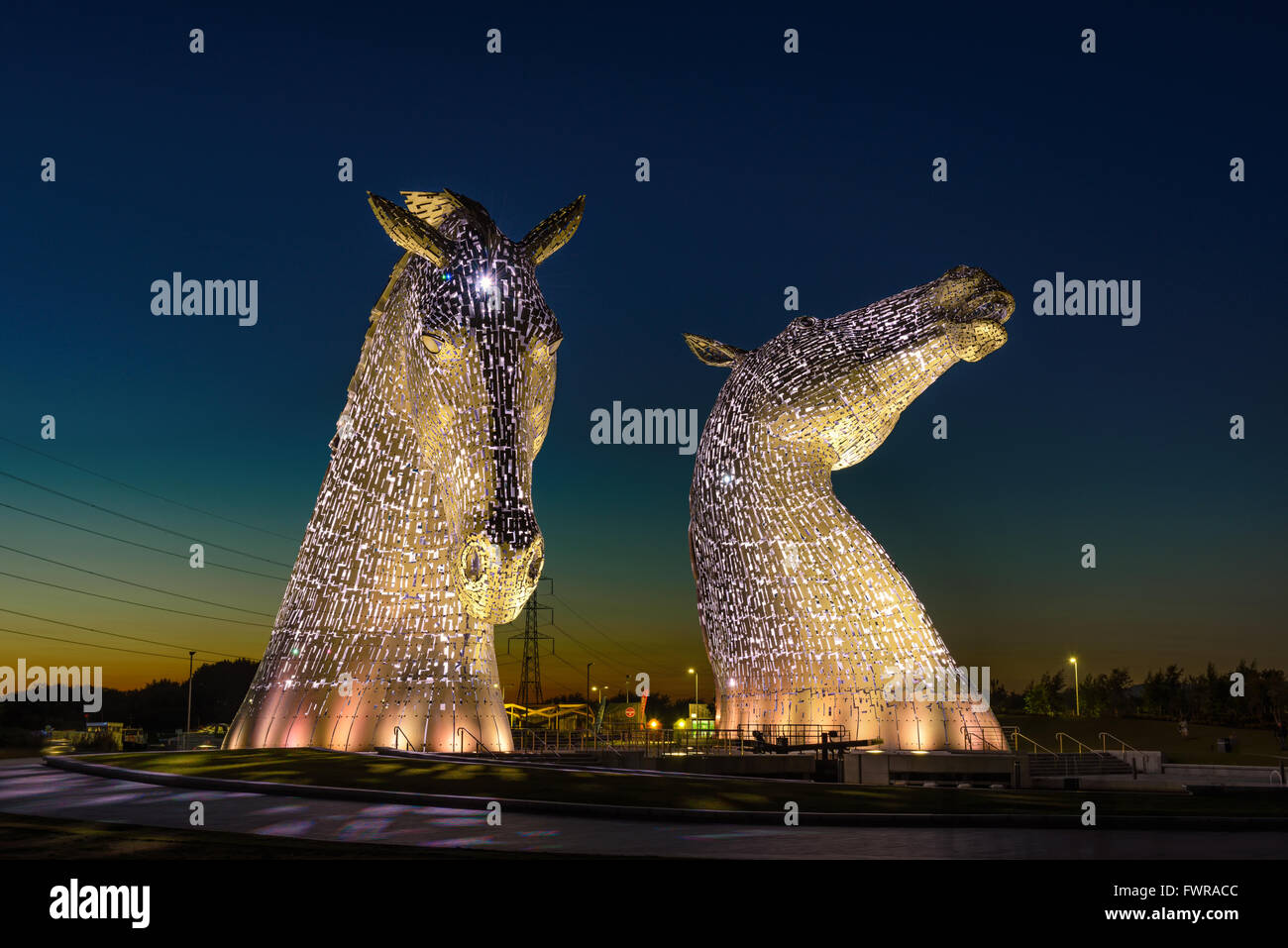 The Kelpies Horse statue lit up at night at The Helix Park in Falkirk