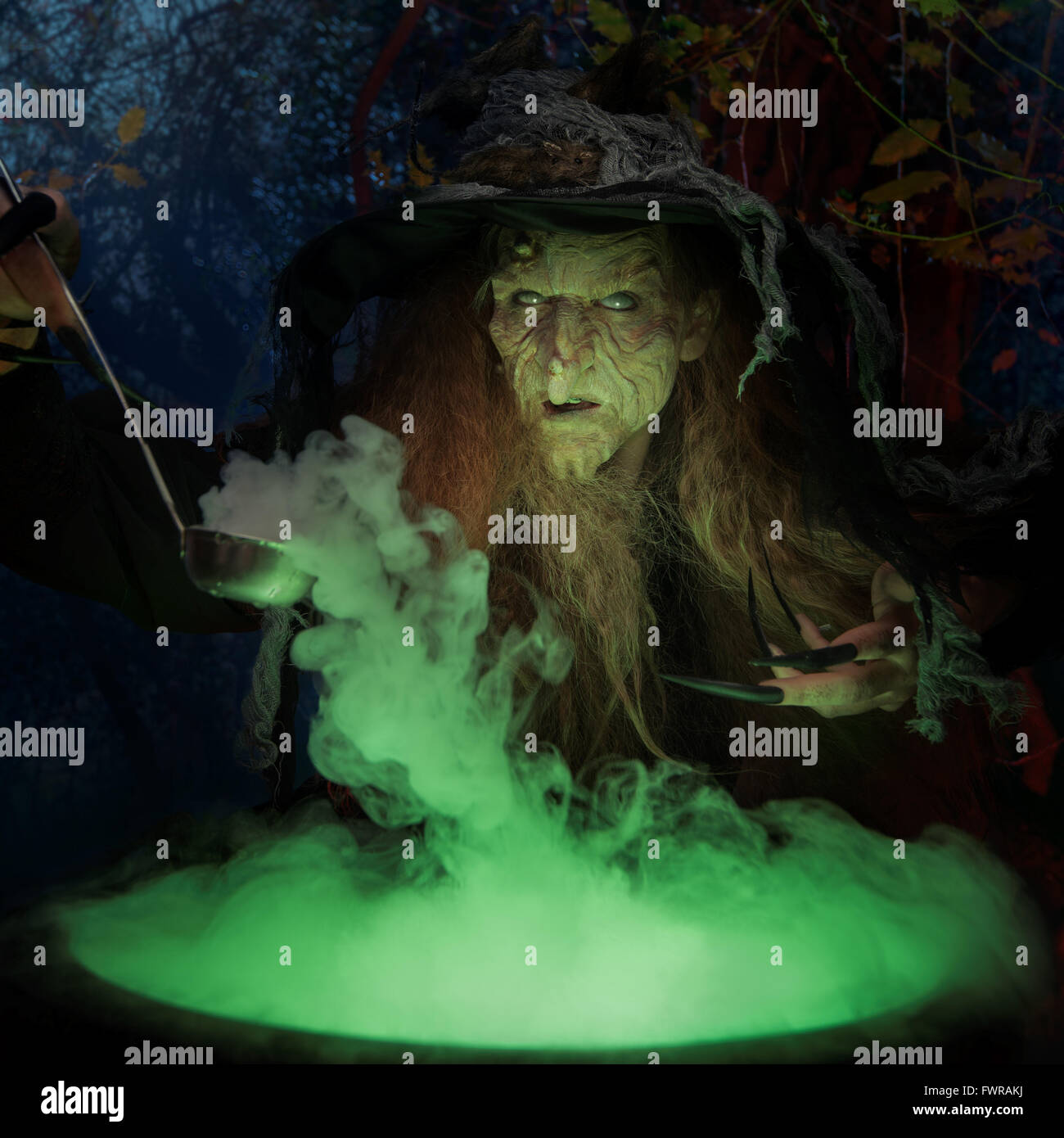 Old witch with magical potion Stock Photo