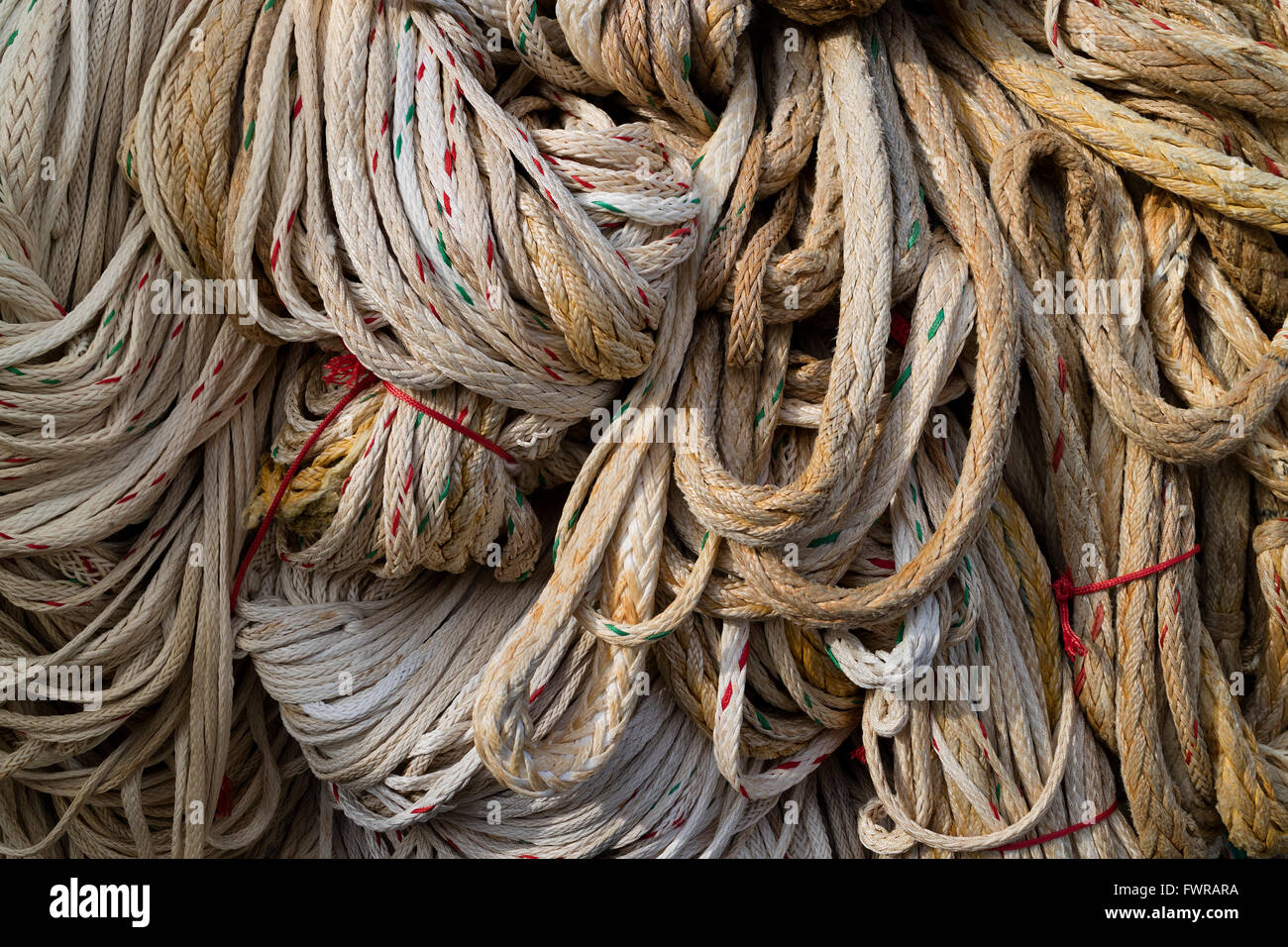 Large long ropes hanging to dry Stock Photo