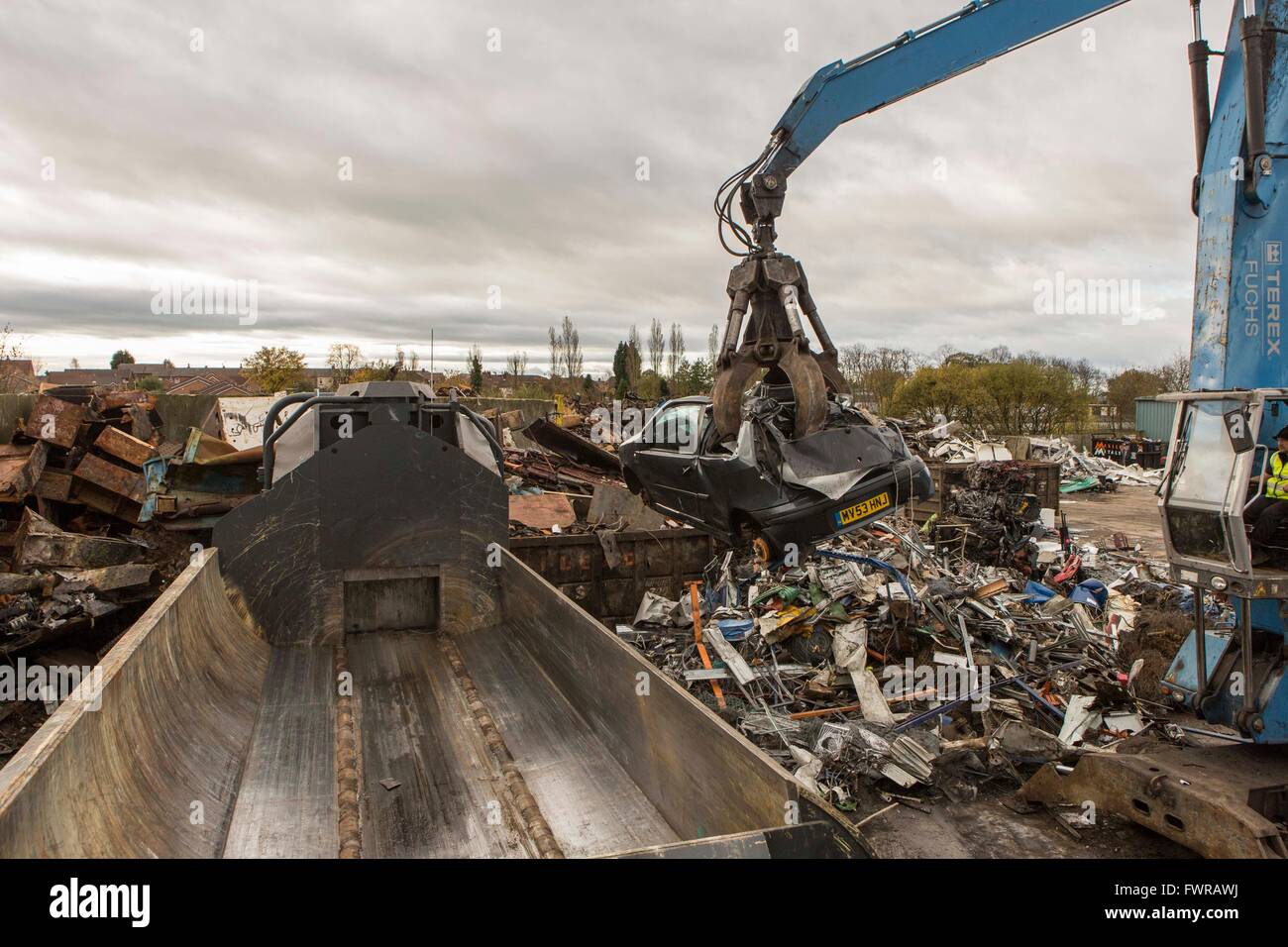 A car crusher in a metal scrap yard in England Stock Photo Alamy