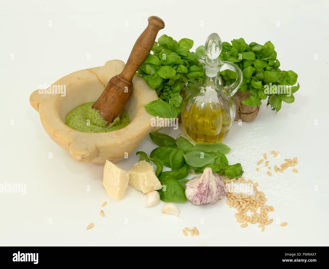 ingredients of the pesto along with marble mortar and pestle Stock