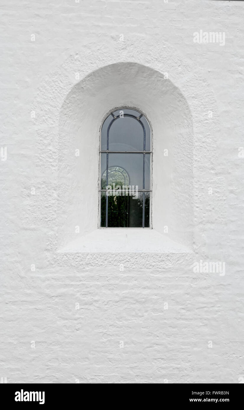 Arched latticed window in a white church wall Stock Photo - Alamy