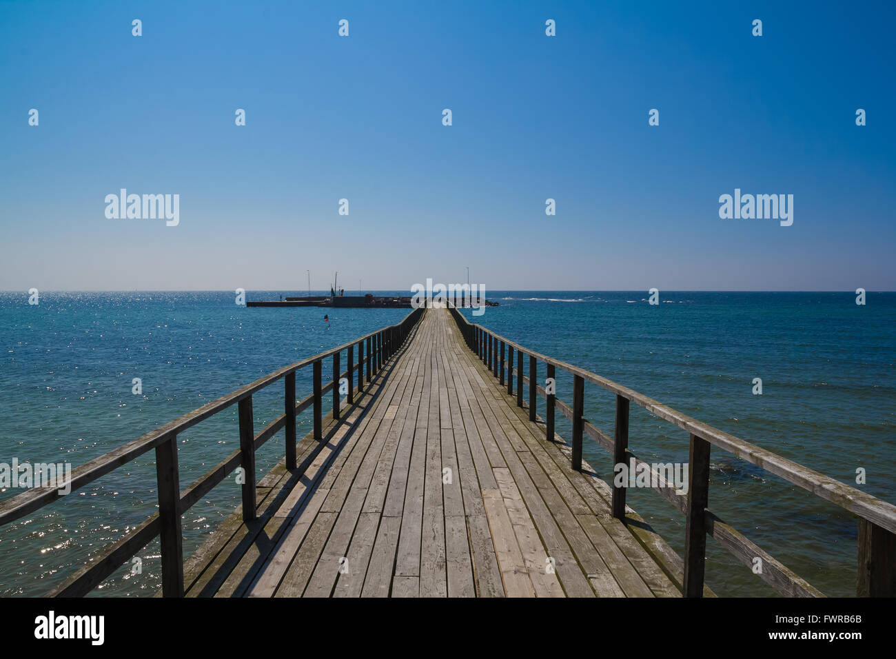 Longest wood pier in Northern Europe, at Arnager on Bornholm in Denmark Stock Photo