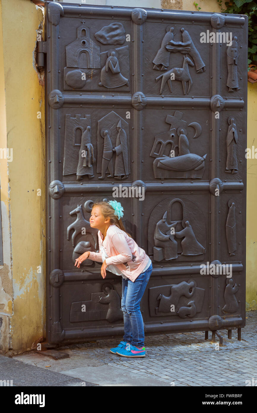 PRAGUE, CZECH REPUBLIC - AUGUST 25, 2015: Young girl posing in the old town of Prague, Czech Republic Stock Photo