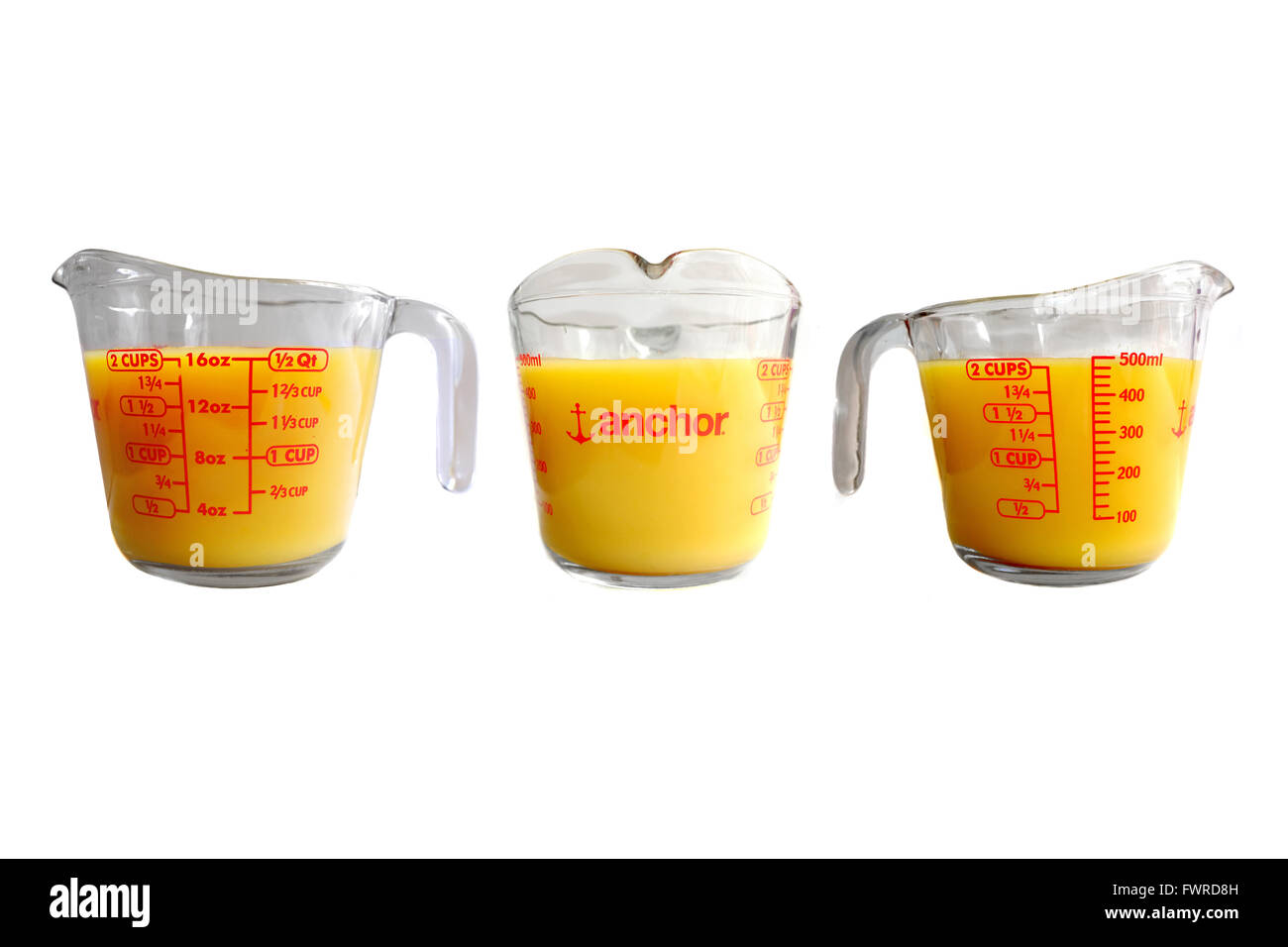 https://c8.alamy.com/comp/FWRD8H/three-sides-of-an-anchor-jug-full-of-yellow-liquid-photographed-against-FWRD8H.jpg