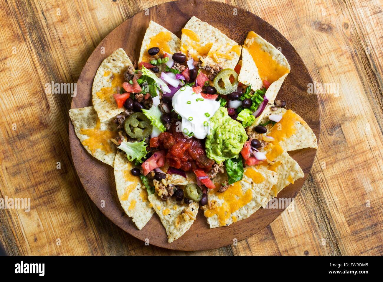 Nacho Cheese Tortilla chips with chili ,salsa ,sour cream and guacamole