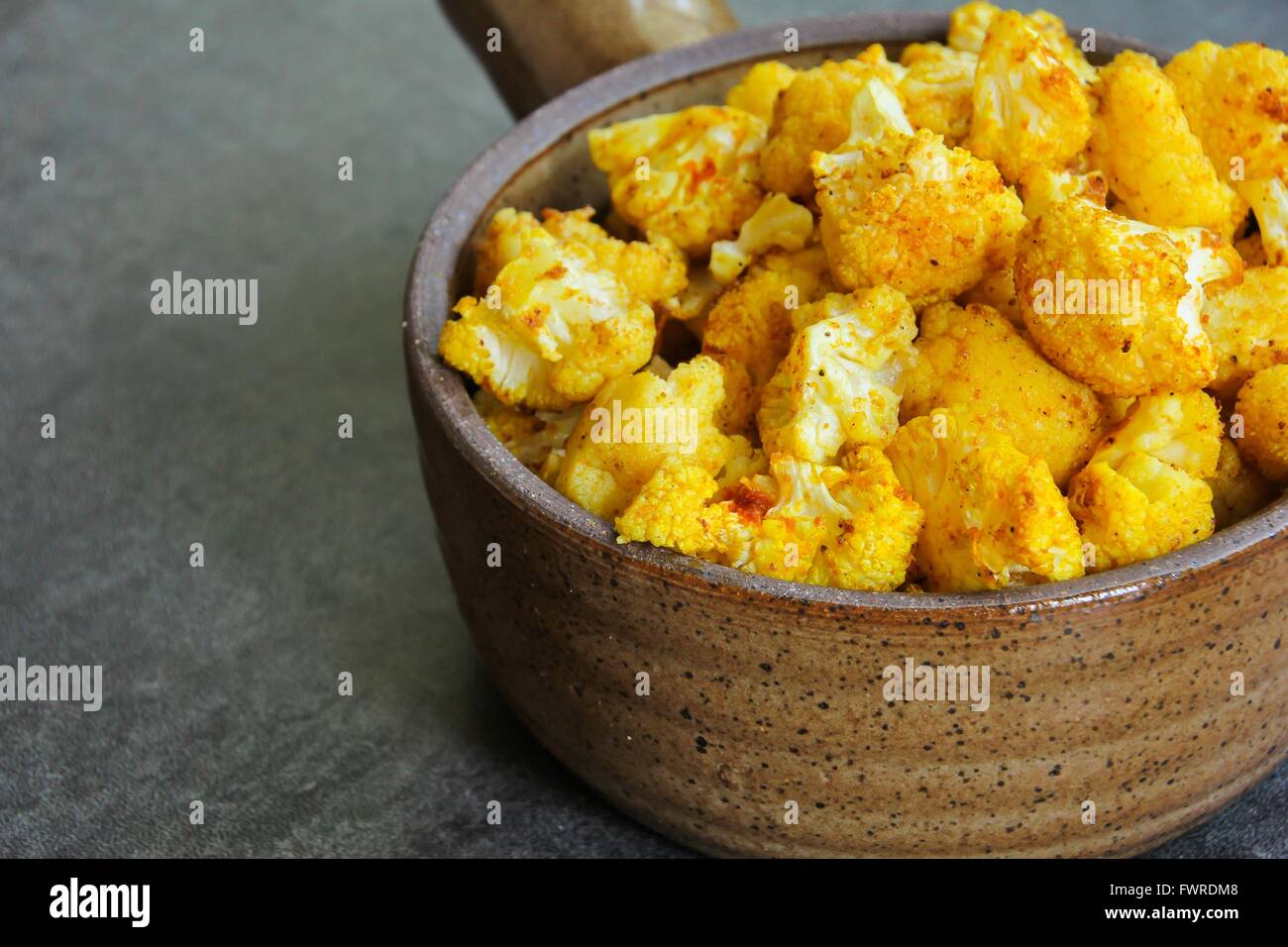 Healthy food - Oven Roasted Cauliflower in ceramic pot Stock Photo
