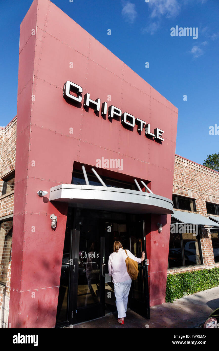 Miami Florida,Chipotle,restaurant restaurants food dining cafe cafes,Mexican food,front,entrance,adult adults,woman female women,entering,FL160324172 Stock Photo