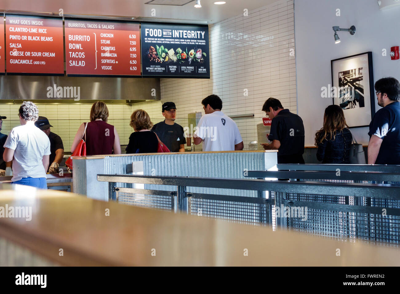 Miami Florida,Chipotle,restaurant restaurants food dining cafe cafes,Mexican,interior inside,order service line,queue,overhead menu,food with integrit Stock Photo