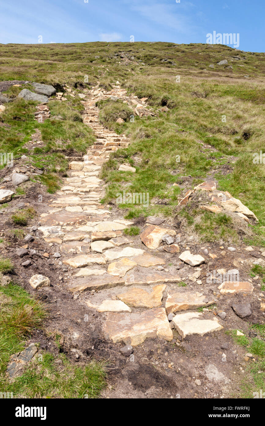 Newly built stone path and steps on a hill as part of a moorland restoration project. Grindslow Knoll, Kinder Scout, Derbyshire, Peak District, UK Stock Photo