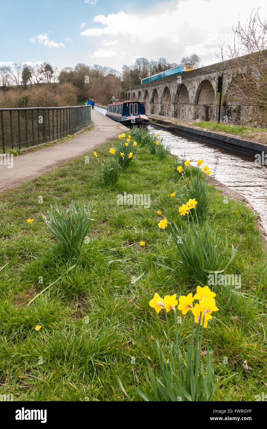 Chirk Aqueduct and Viaduct in North East Wales a designated heritage area with a canal barge and local train in the shot Stock Photo