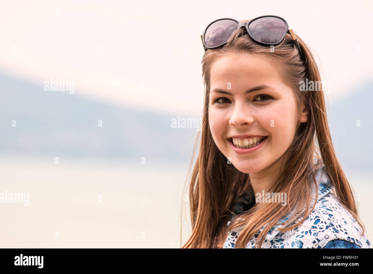 Portrait of smiling young girl Stock Photo - Alamy