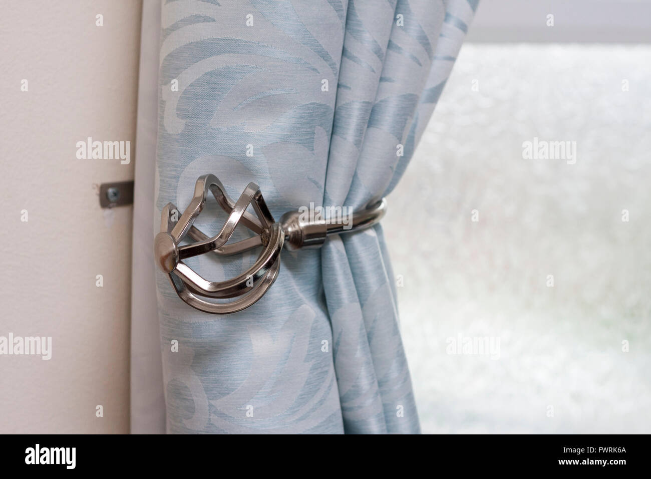 Close Up Of A Chrome Metal Curtain Tieback Stock Photo 101938210