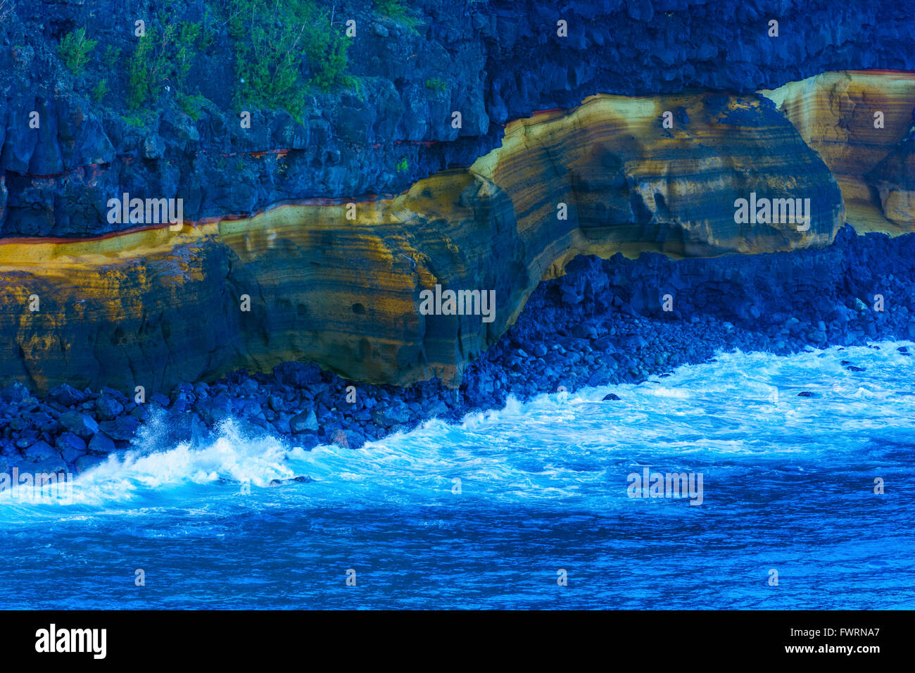 eroding sea cliffs pounded by surf Maui, Hawaii, USA Stock Photo