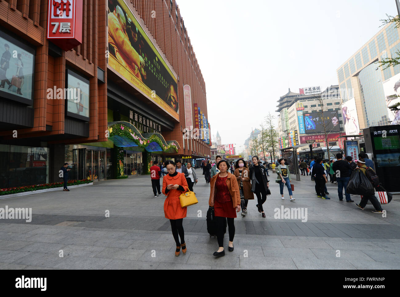 Residents of Beijing wear breathing masks do to bad pollution. Stock Photo