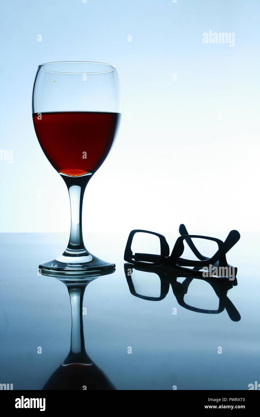 Alcoholic Drink and a pair of eyeglasses Stock Photo Alamy