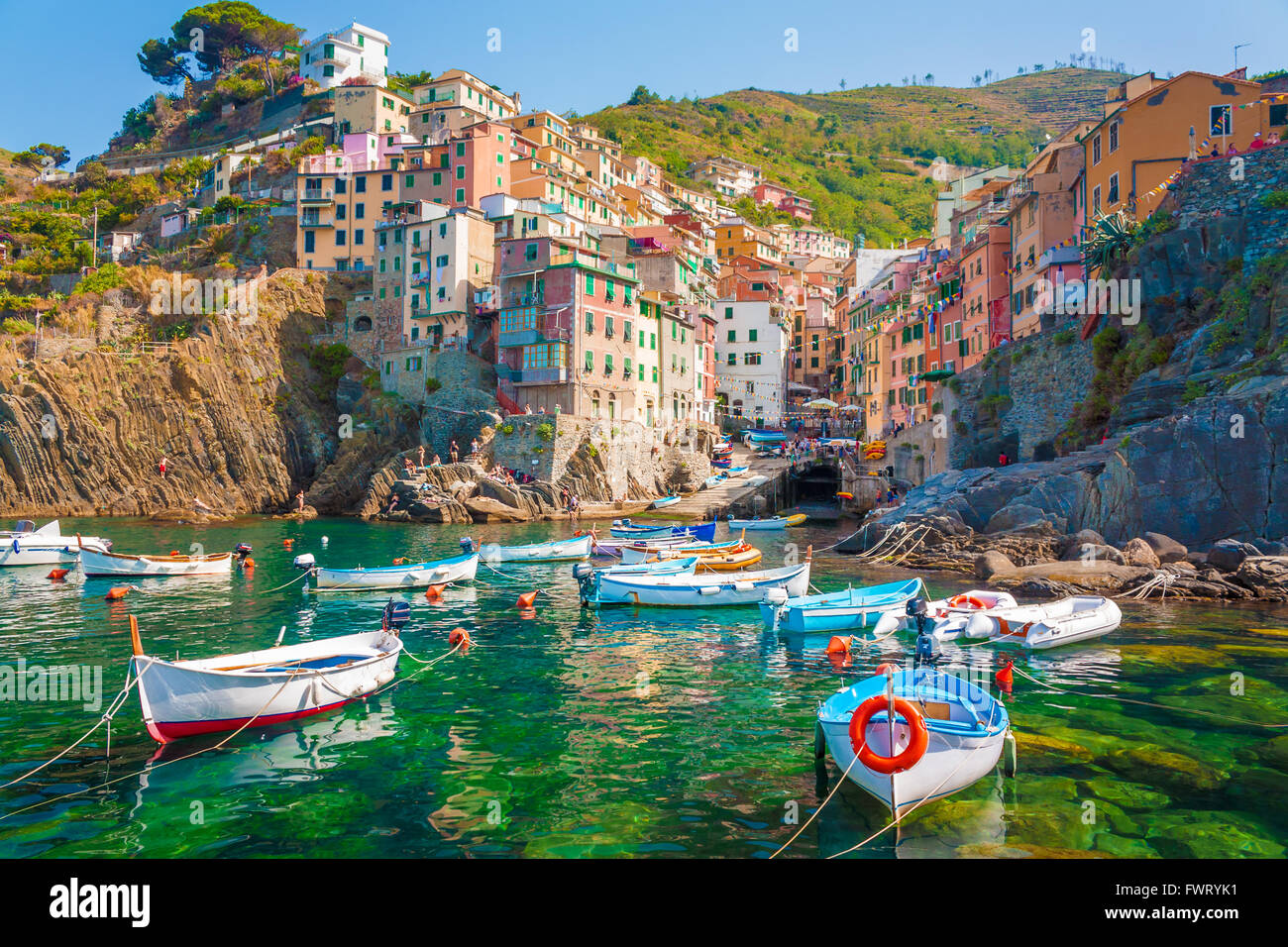 Riomaggiore is the first city of the Cique Terre sequence of hill cities, Liguria, Italy. It has a small dock that provides a go Stock Photo