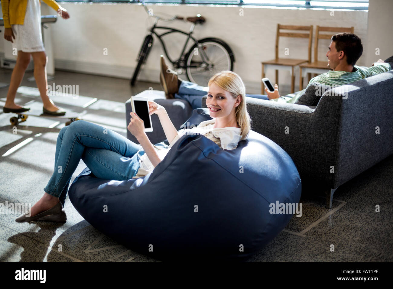 Man woman sitting on bean bag hi-res stock photography and images - Alamy