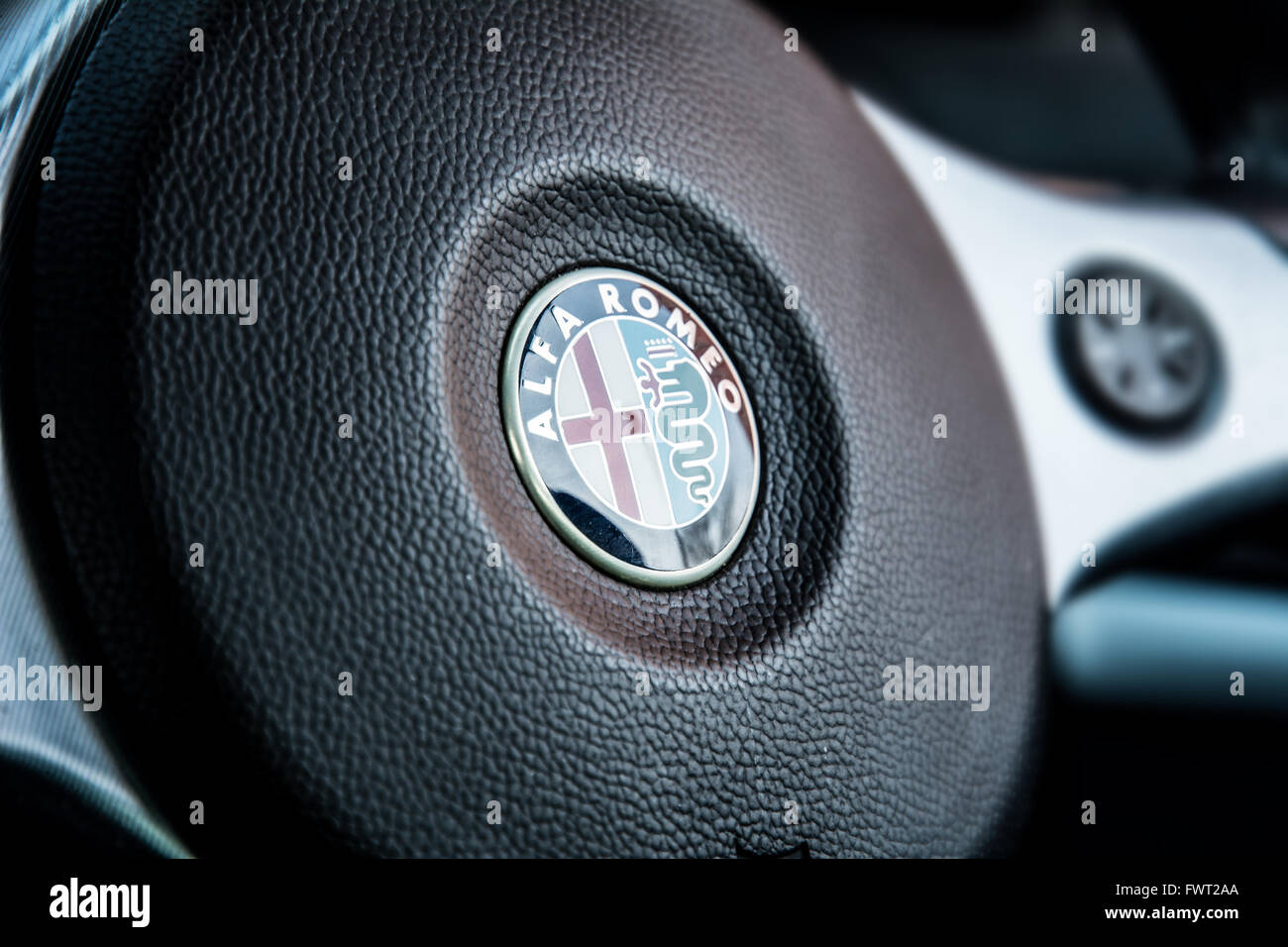 A close up of an Alfa Romeo steering wheel taken in an Alfa 159. Stock Photo