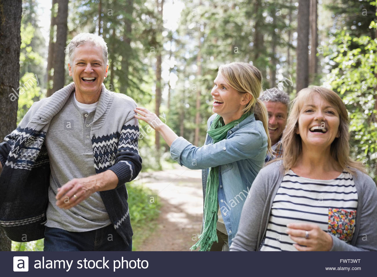 Middle-aged friends enjoying their walk outdoors Stock Photo