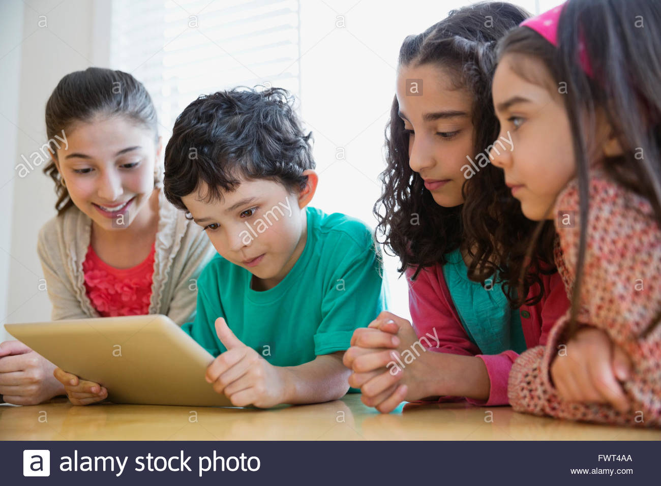 Children sharing a Digital Tablet Stock Photo
