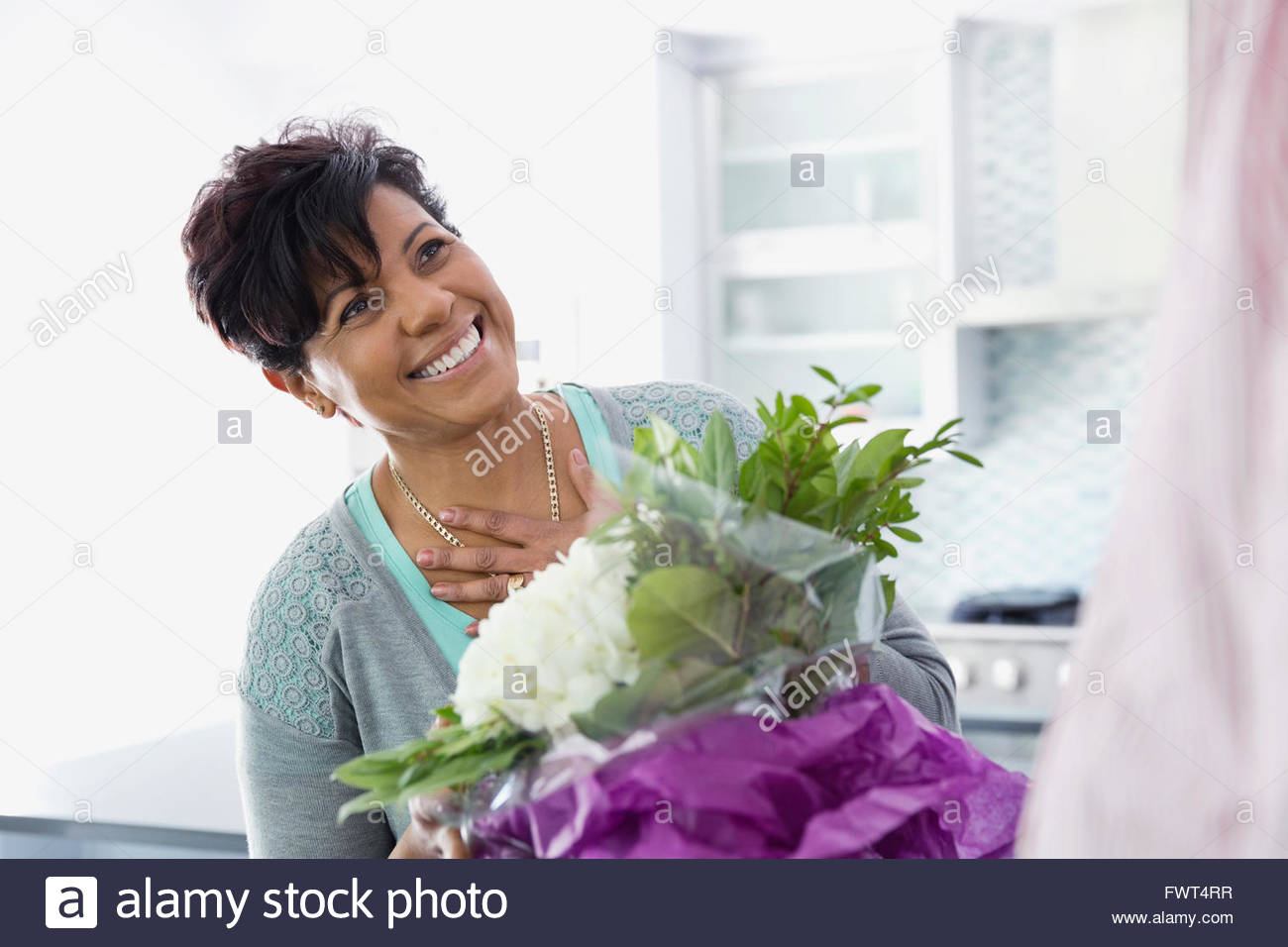 Mature woman delighted to receive flower bouquet Stock Photo Alamy