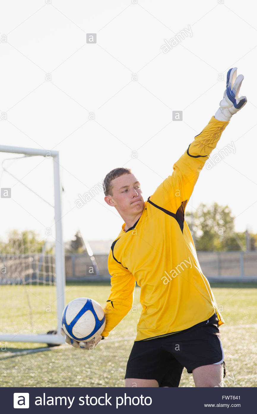 Soccer goalie ready to throw ball out Stock Photo Alamy