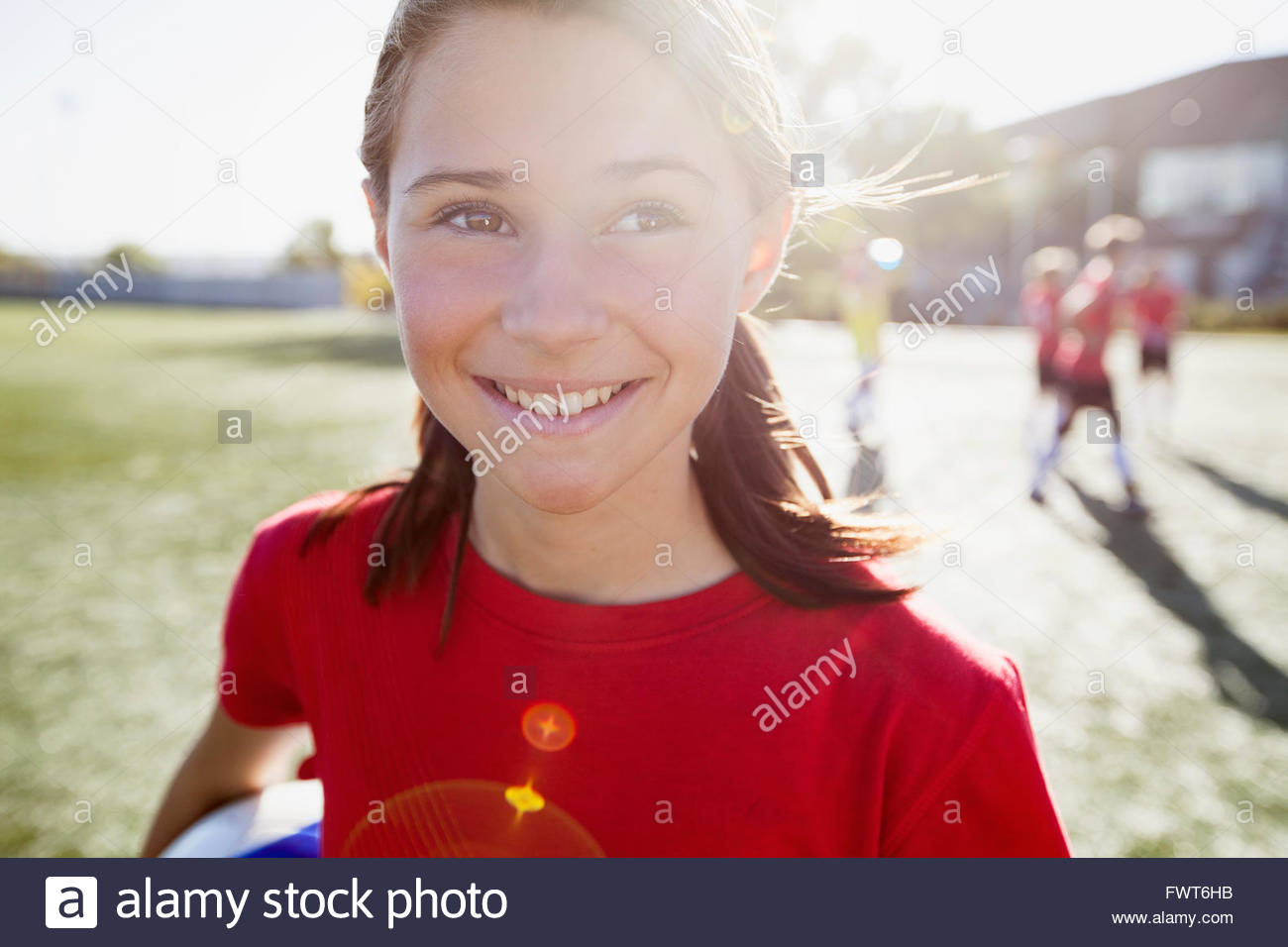 Teenage soccer player with pigtails. Stock Photo