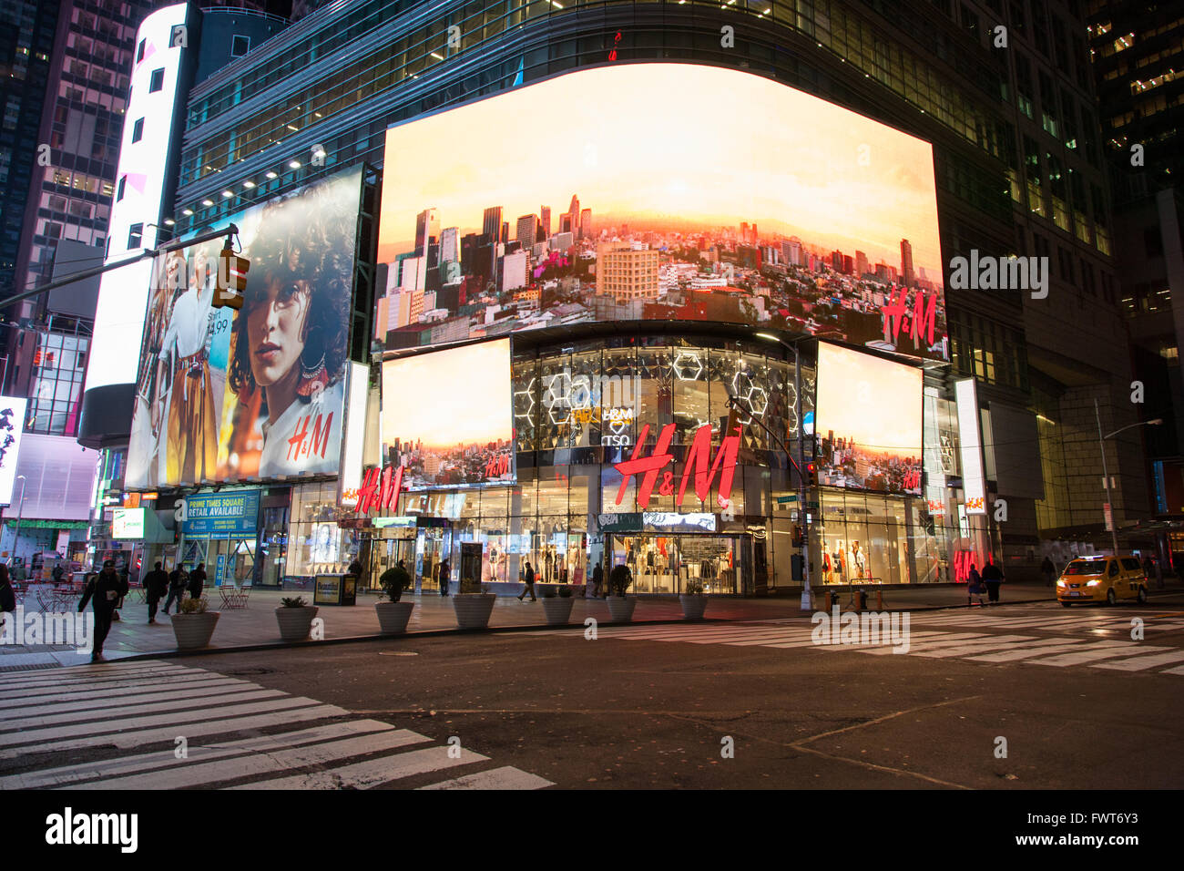 H&M store at night, Times Square, New York City, United States of America. Stock Photo
