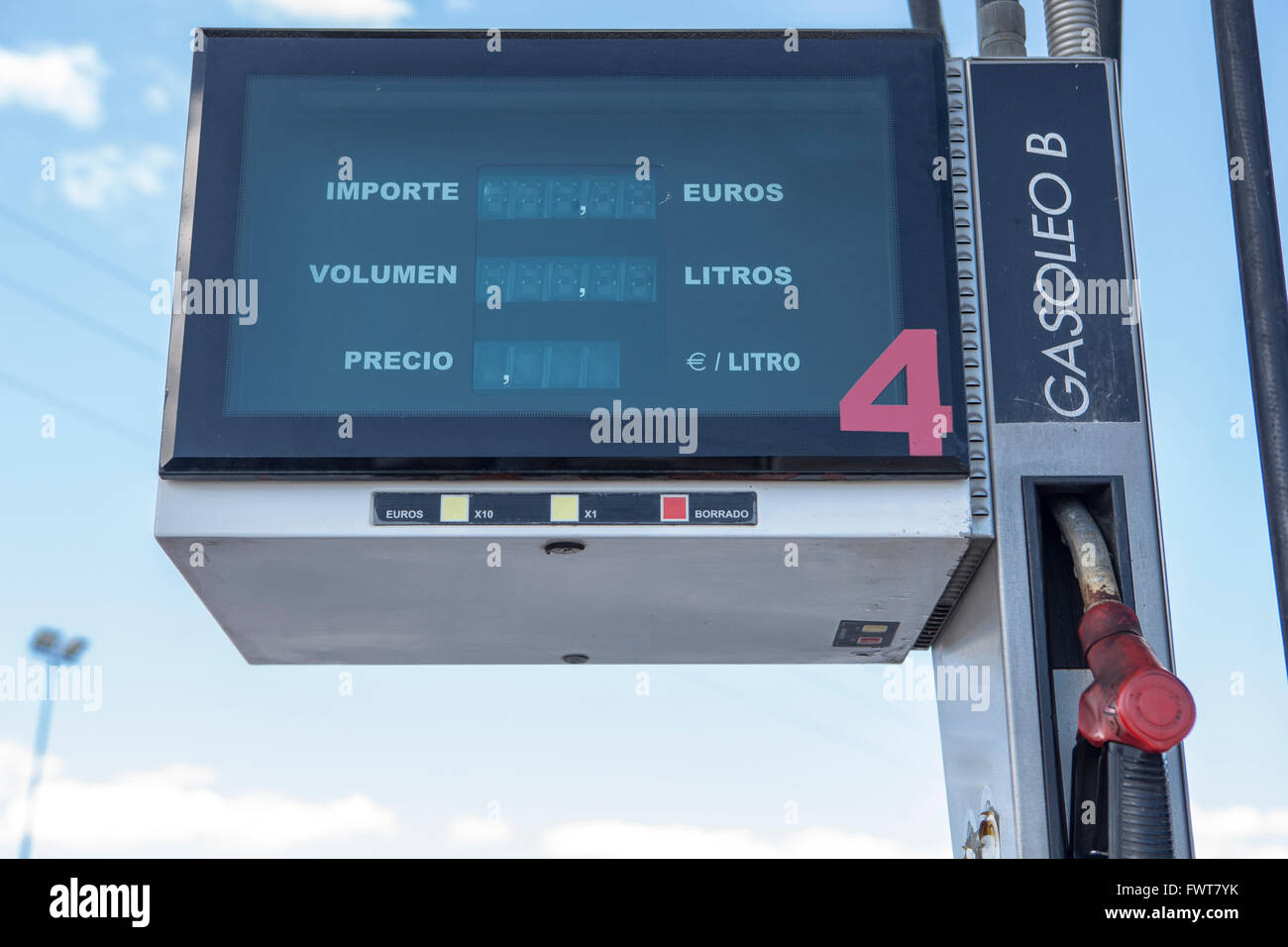 Electronic gas petrol pump displaying the petrol meter. Red diesel pump