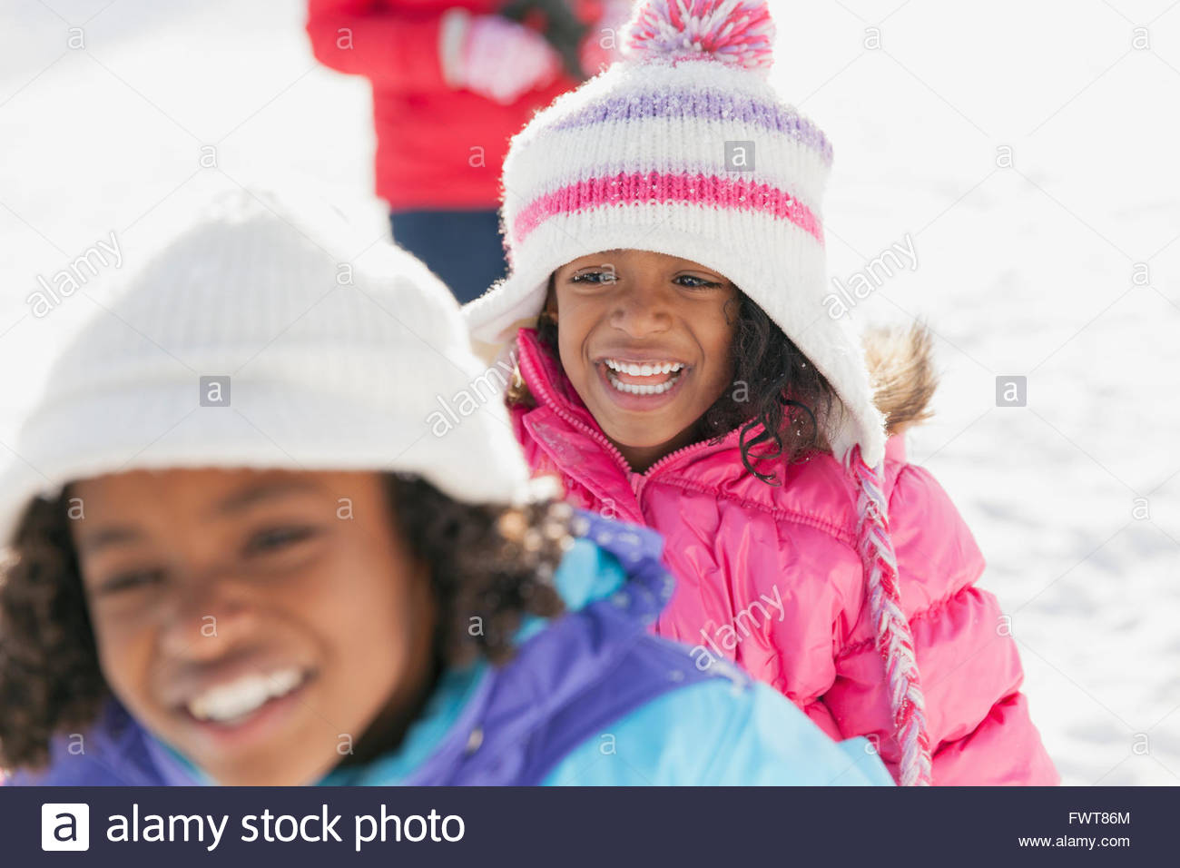 Cheerful little girls outdoors in winter Stock Photo