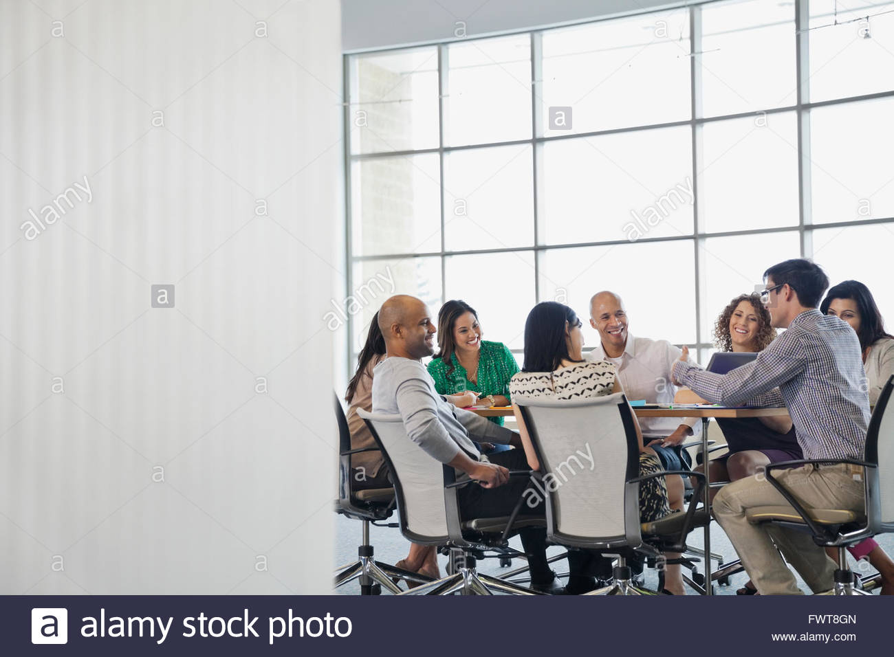 Business people meeting around conference table Stock Photo Alamy