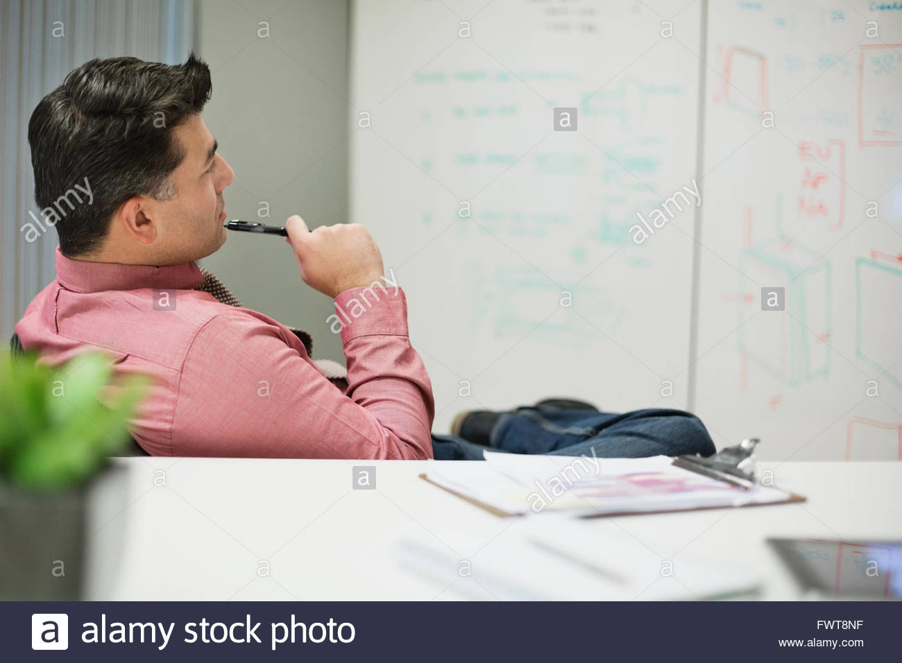 Businessman planning business strategy while sitting in board room Stock Photo