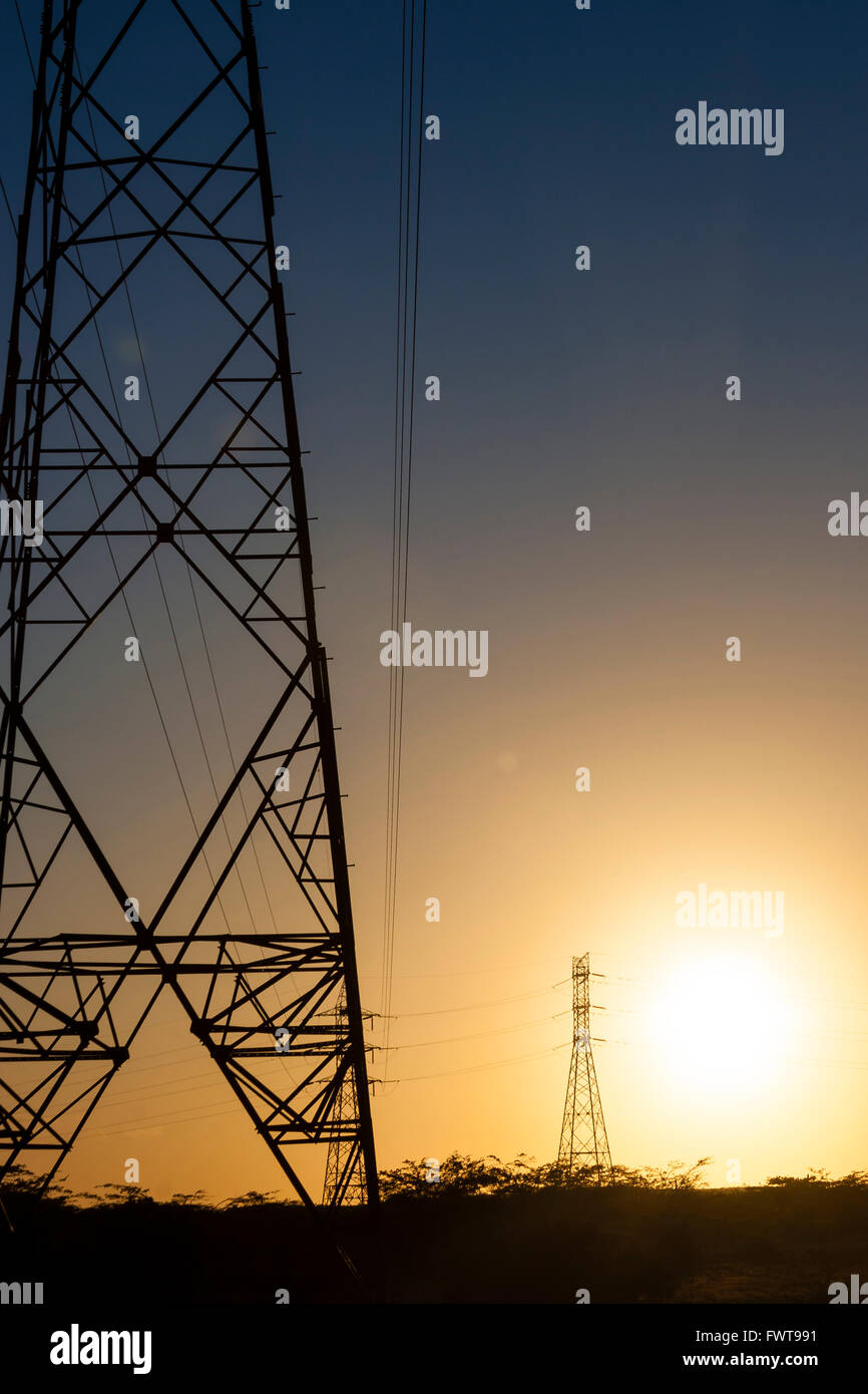 Silhouette of power lines and transmission towers at sunset Stock Photo ...