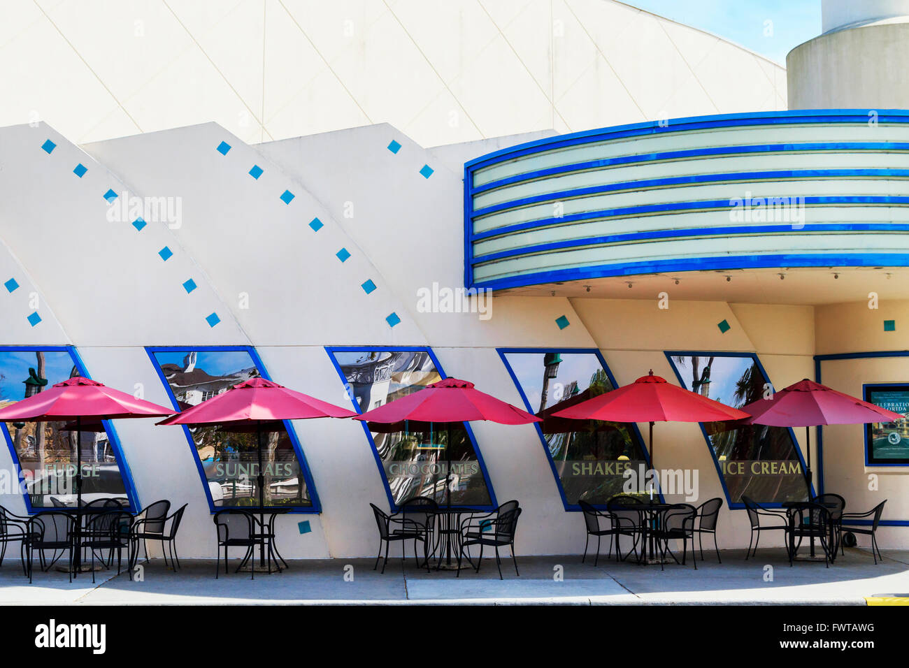 Cafe tables and chairs outside the Art Deco cinema in Celebration, Osceola County, Florida, America, USA Stock Photo