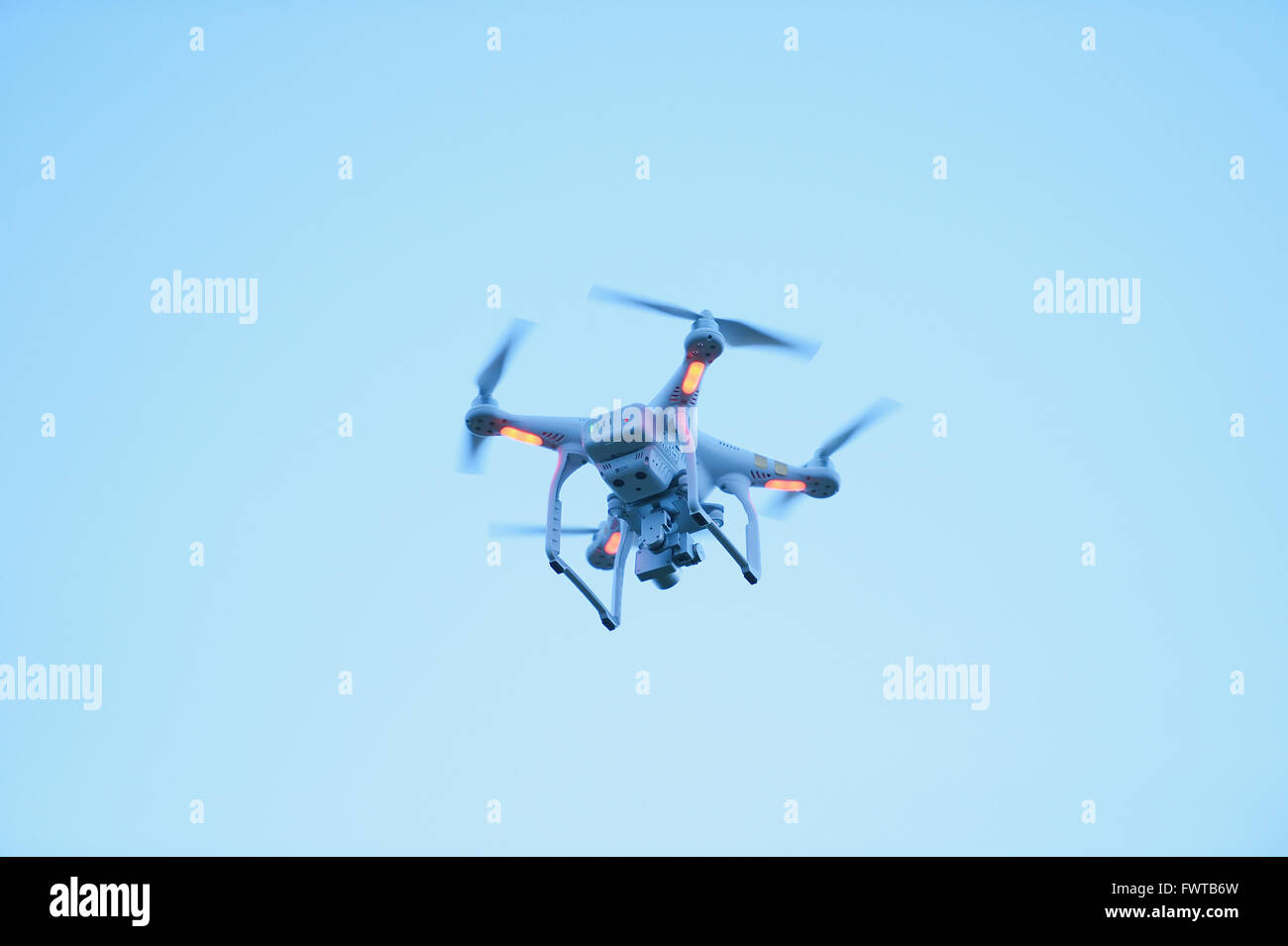 Drone flying in the morning sky Stock Photo