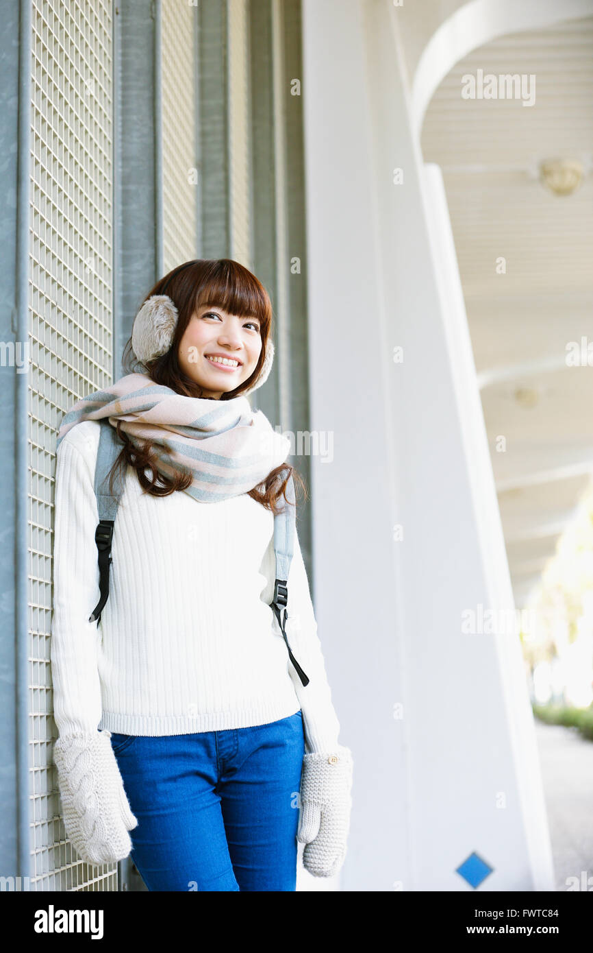 Attractive Japanese woman with muffler on a Winter sunny day Stock