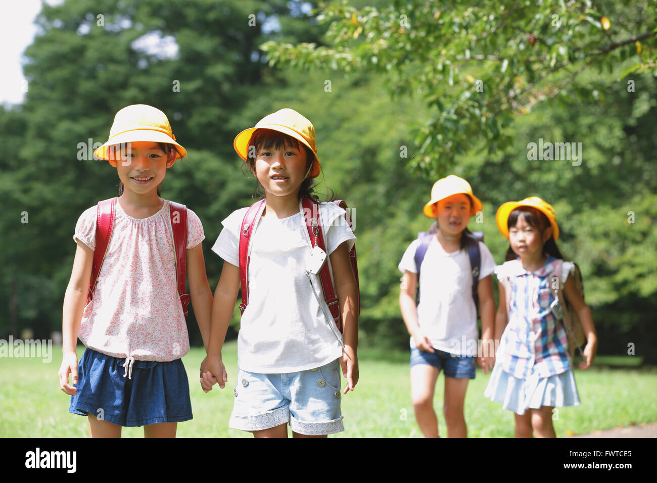 Japanese kid in a city park Stock Photo