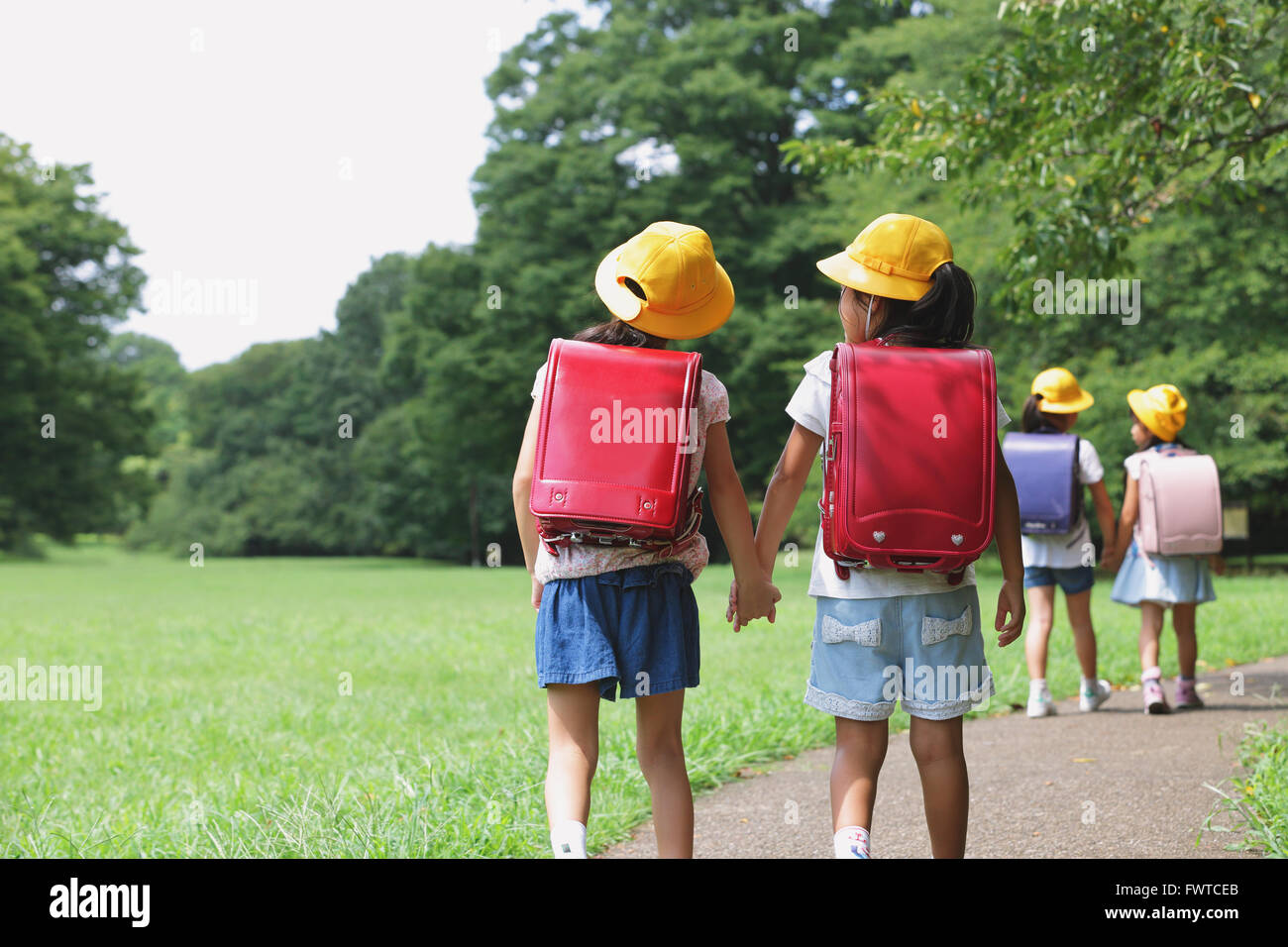 Japanese kid in a city park Stock Photo