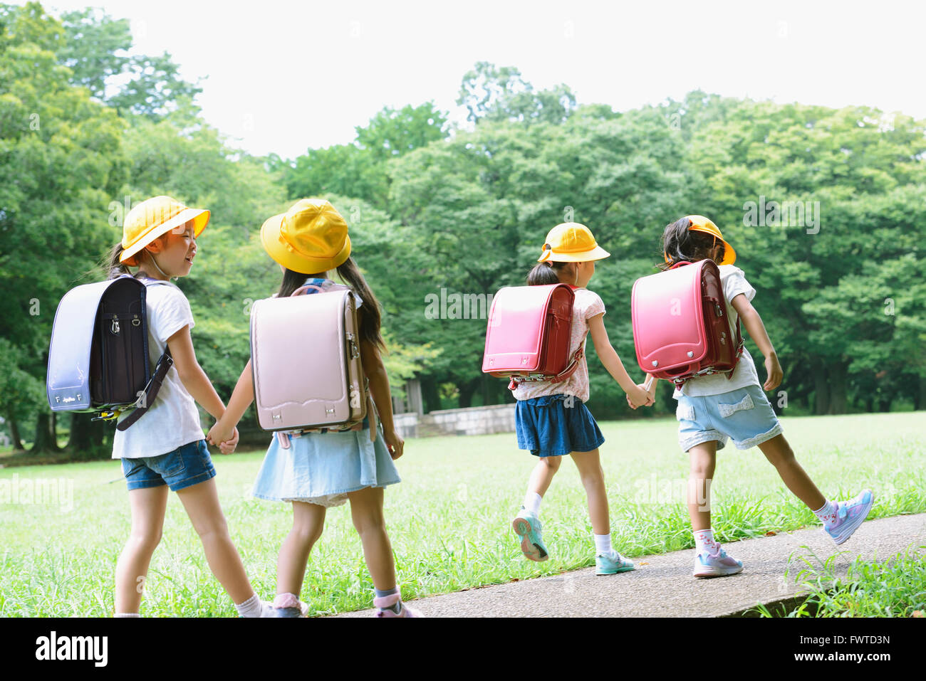 Japanese kid in a city park Stock Photo