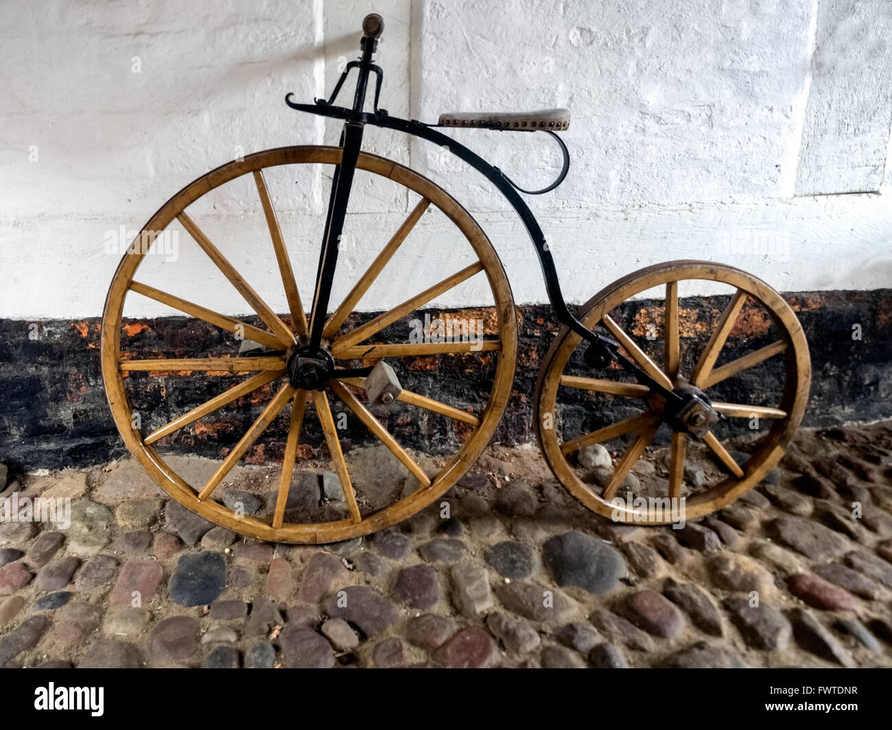 Wooden penny farthing bike Stock Photo