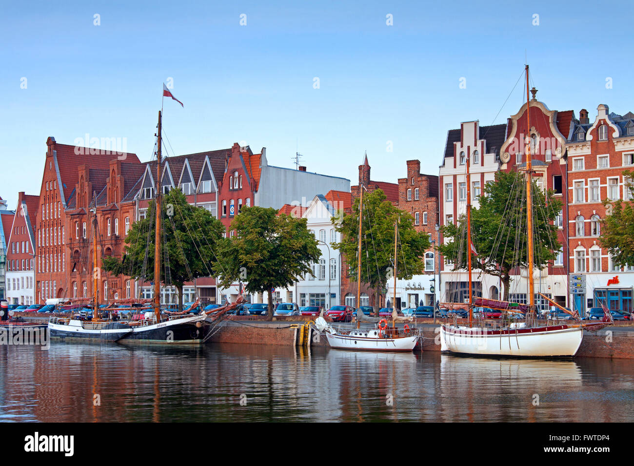 Museums harbour with traditional sailing ships berthed at the Untertrave in the Hanseatic town Lübeck, Germany Stock Photo